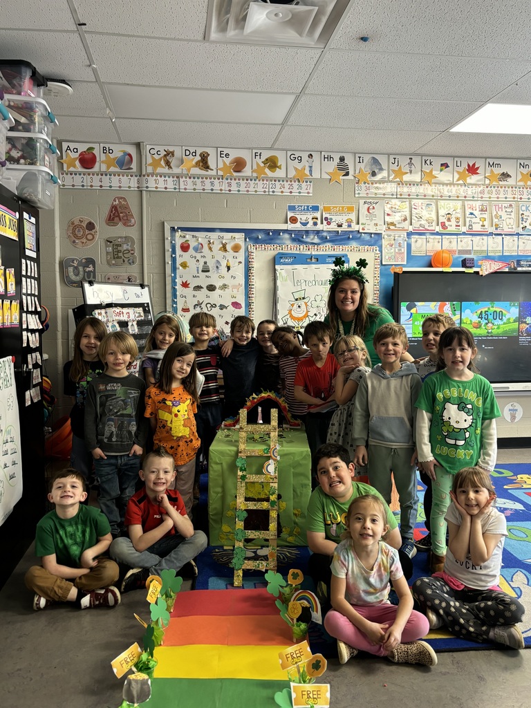 Students posing for a group photo while dressed up for St. Patricks Day.