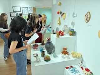 Students browsing an art gallery.