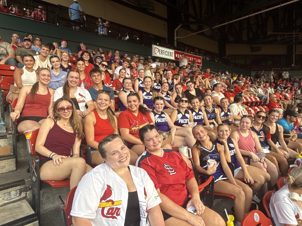 A large group of students in a Cardinal's baseball arena.