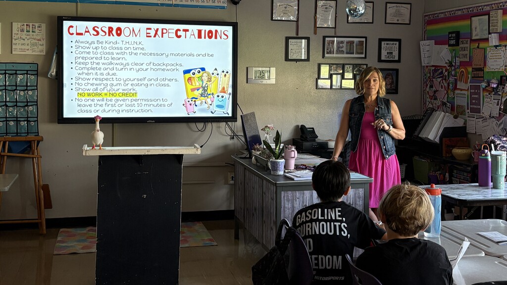 A teacher giving a presentation on classroom expectations.