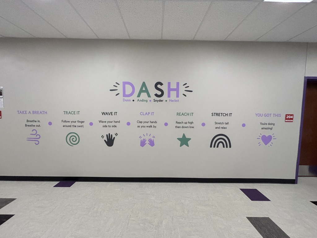 An entire wall in a school hallway with a "Dash" title and corresponding icons.