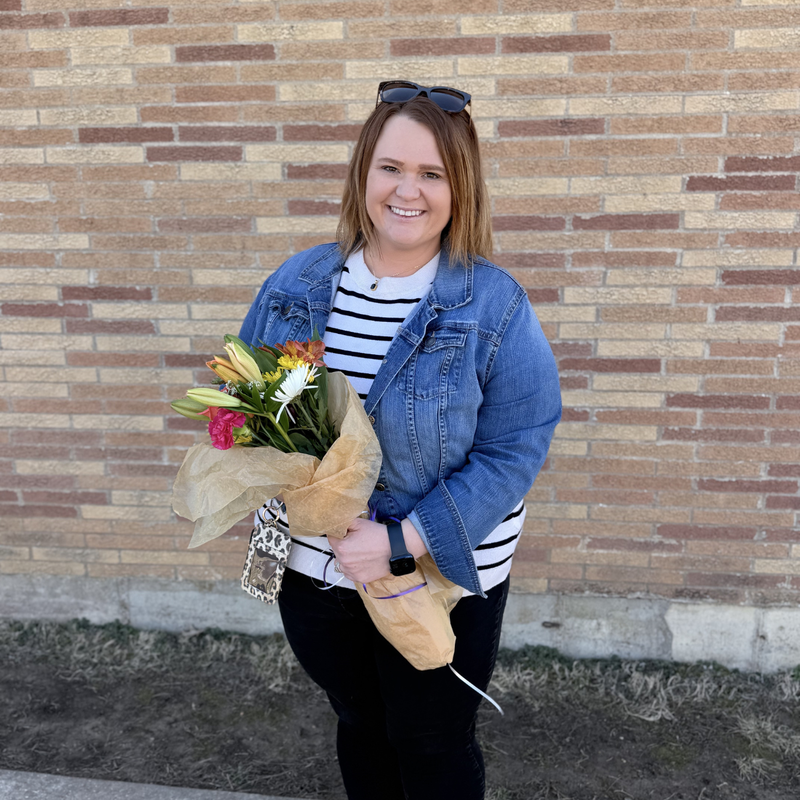 Lauren Blevins, Substitute posing with flowers.