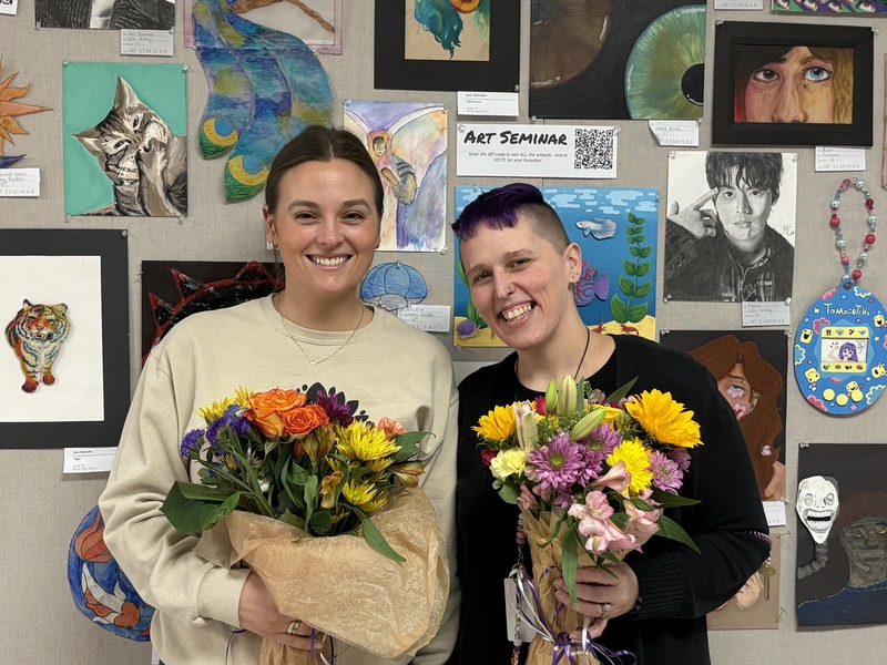 Jordan Garlik, Special Education Teacher and Kim Emht, Secretary posing with flowers.