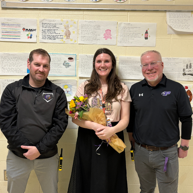Rachel Porter, English Teacher posing with flowers.