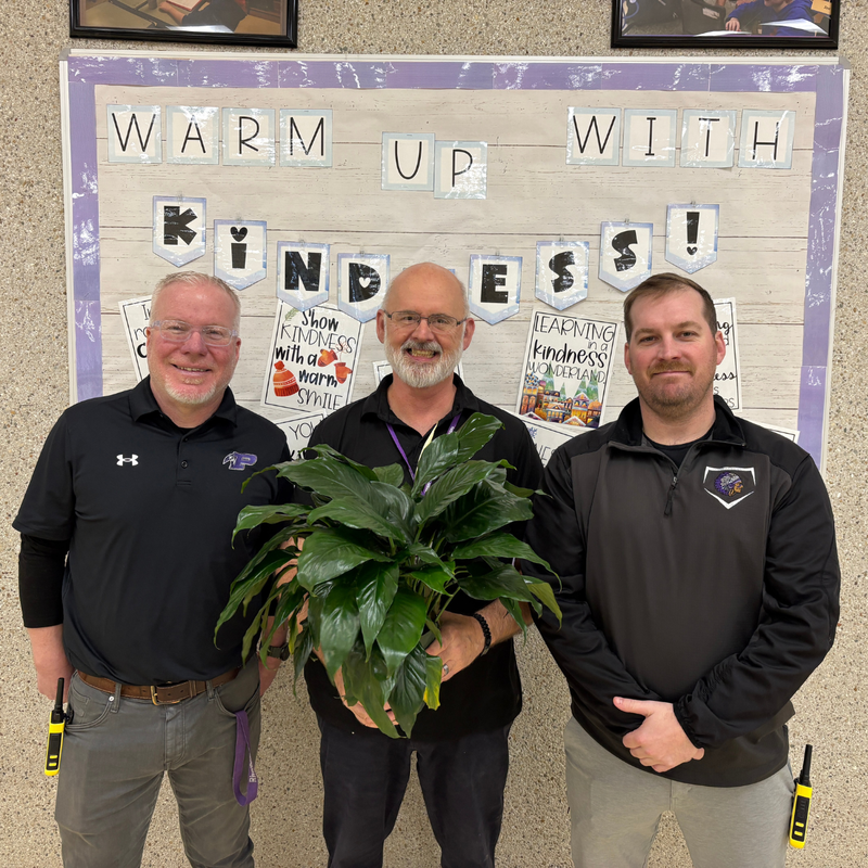 D’wayne Burkhead, Custodian posing with a plant.