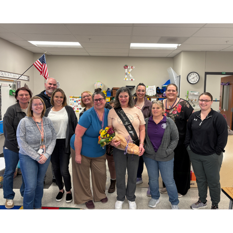 Kelly Knehans, Early Childhood Special Education Teacher posing in a group photo.