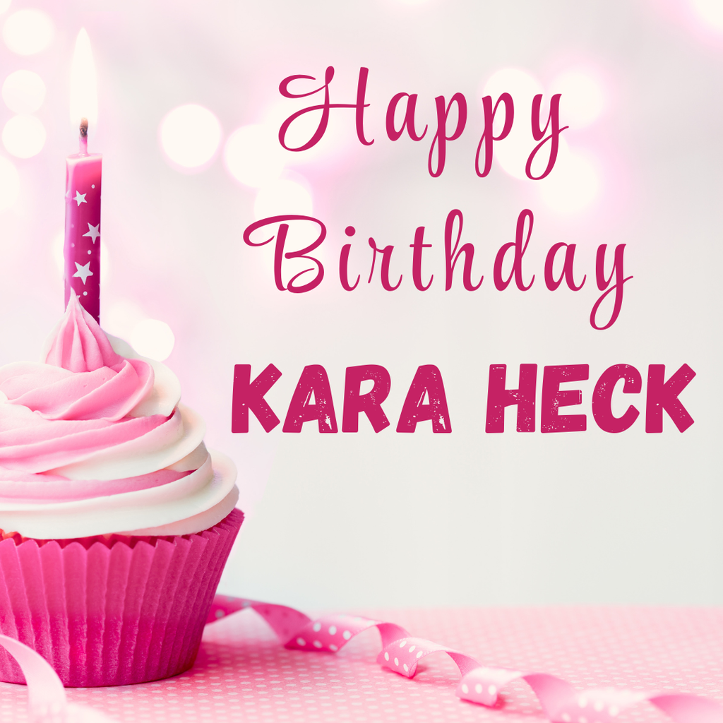A pink cupcake with white frosting and a lit candle, decorated with a pink ribbon. Text reads "Happy Birthday KARA HECK".