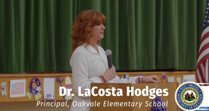 Dr. Lacosta Hodges from Oakvale School addressing her students at the Adopt a Brigade assembly