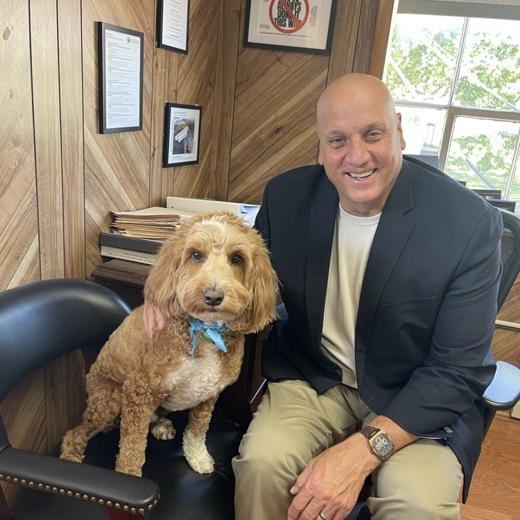 Mr. Toman and Oakvale’s therapy dog