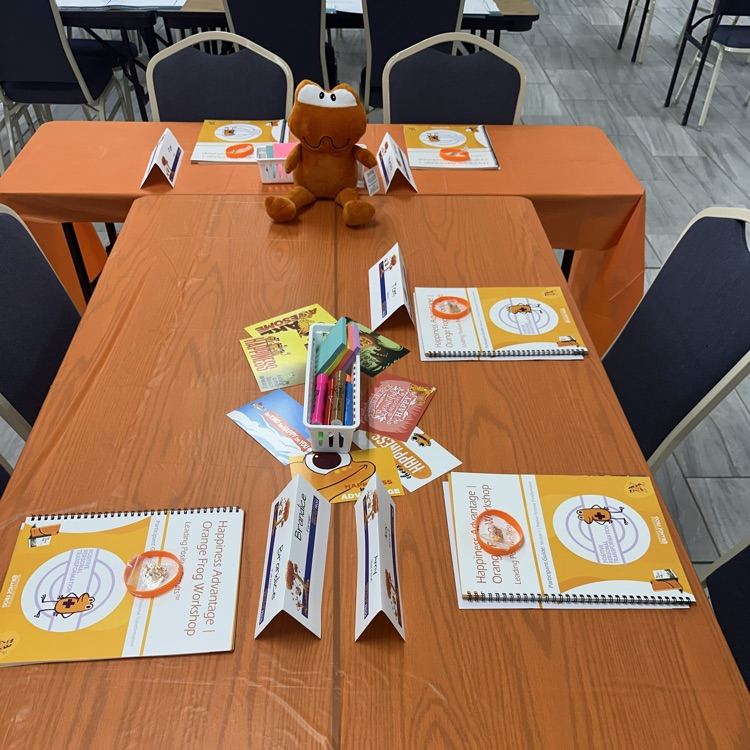 picture of Orange Frog training materials ready on a table  