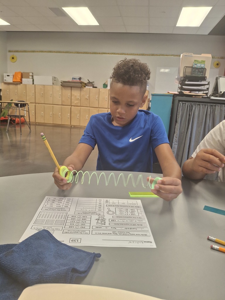 Learning about expanded form by using Slinkies...what an interesting and fun concept!