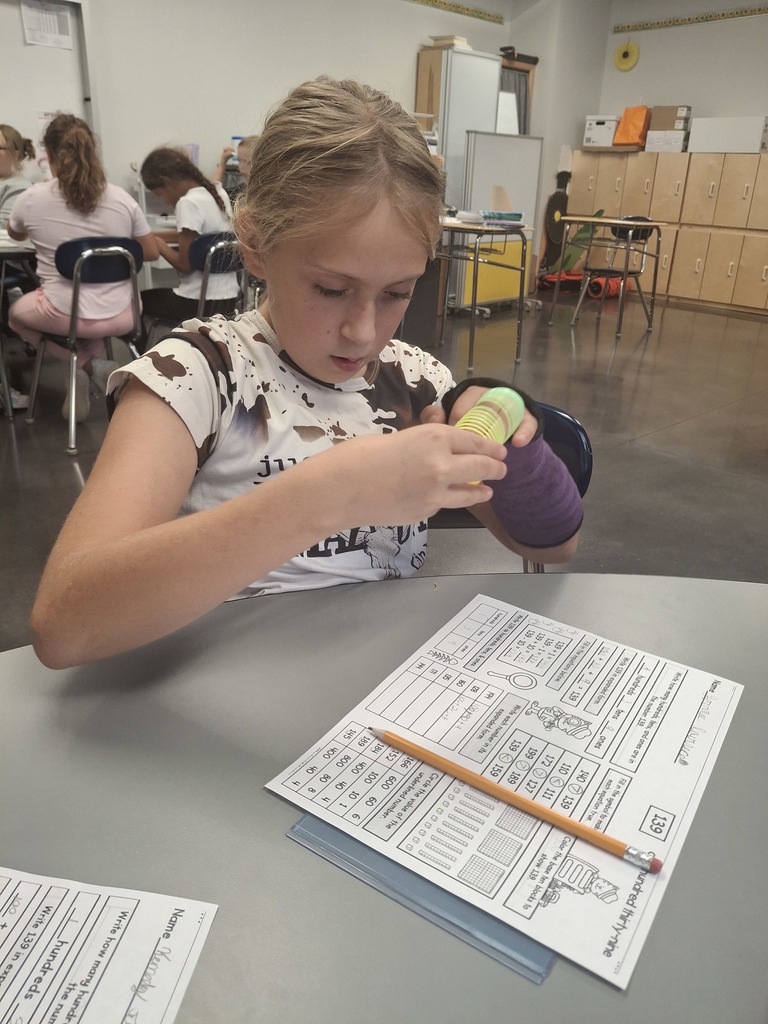 Learning about expanded form by using Slinkies...what an interesting and fun concept!