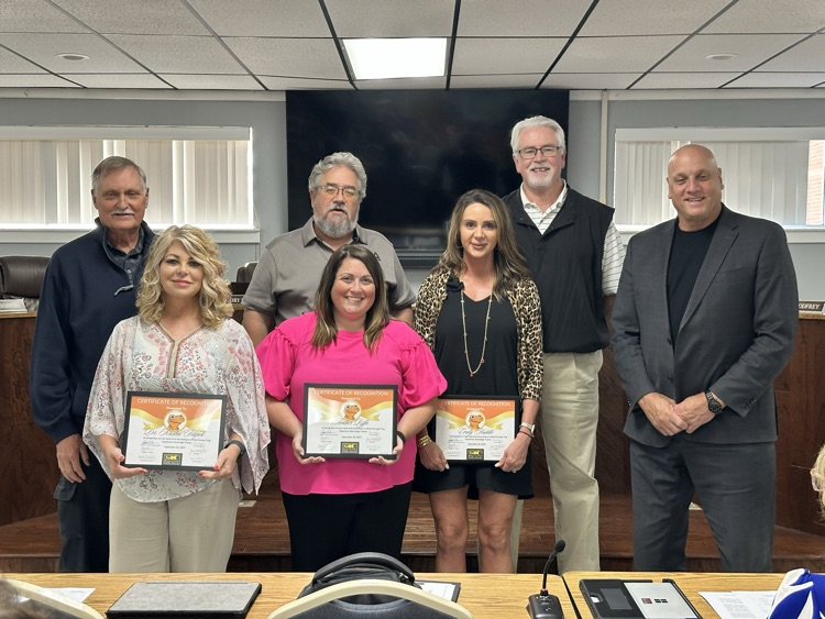 MCBOE recognizes Kristal Filipek, Emily Huddle and Amber Riffe for being Orange Frog trainers 