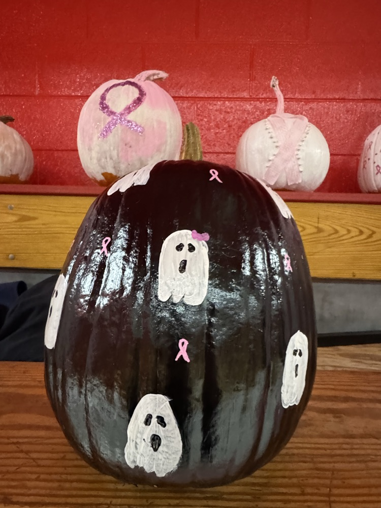 black pumpkin with ghosts