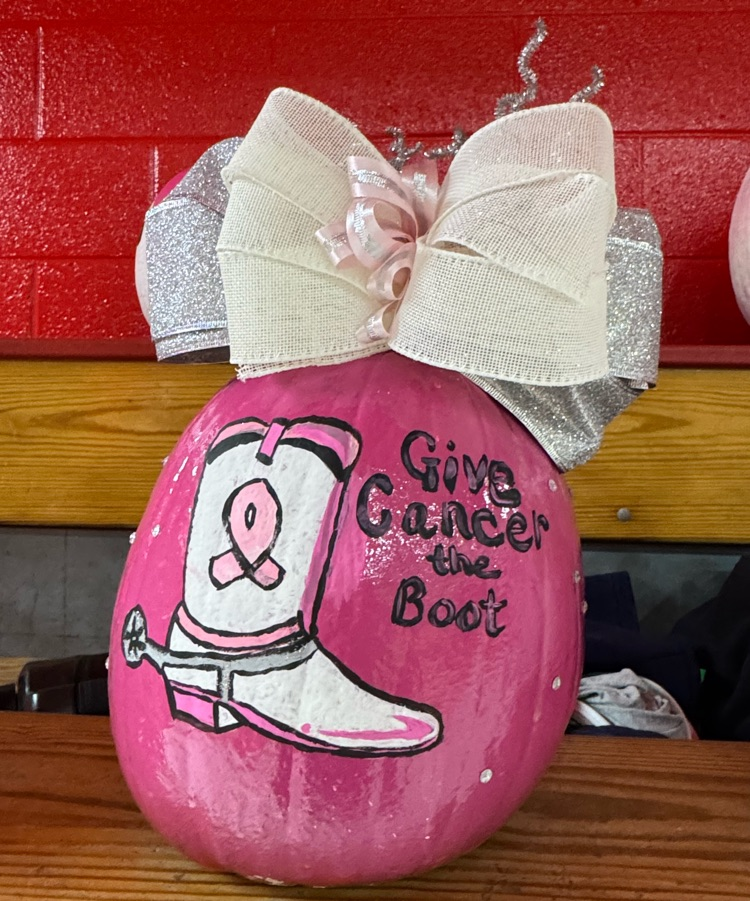 pink pumpkin with a cowboy boot