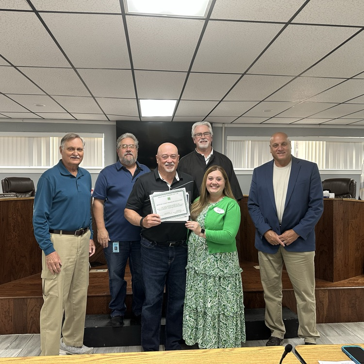 Mark Godfrey recognized by Sarah Brown from 4-H