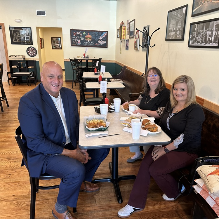 Mr. Toman spotlighting two of his employees, Dr. Amber Bowling and Amy Harrison