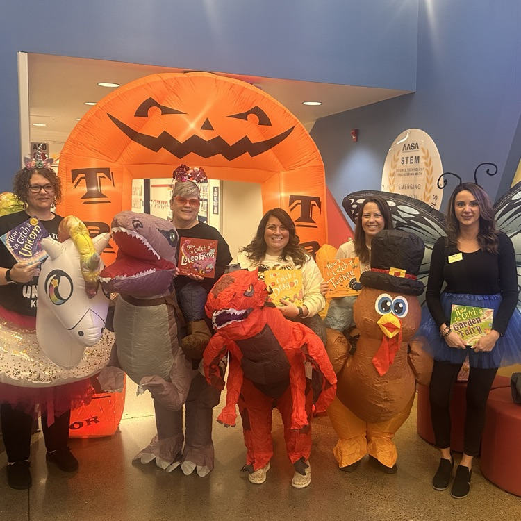 Central Office staff reading Halloween stories to students