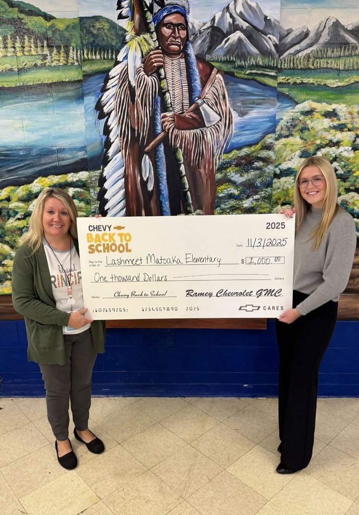 Lashmeet Matoaka School principal accepting the donation from Ramey Chevrolet