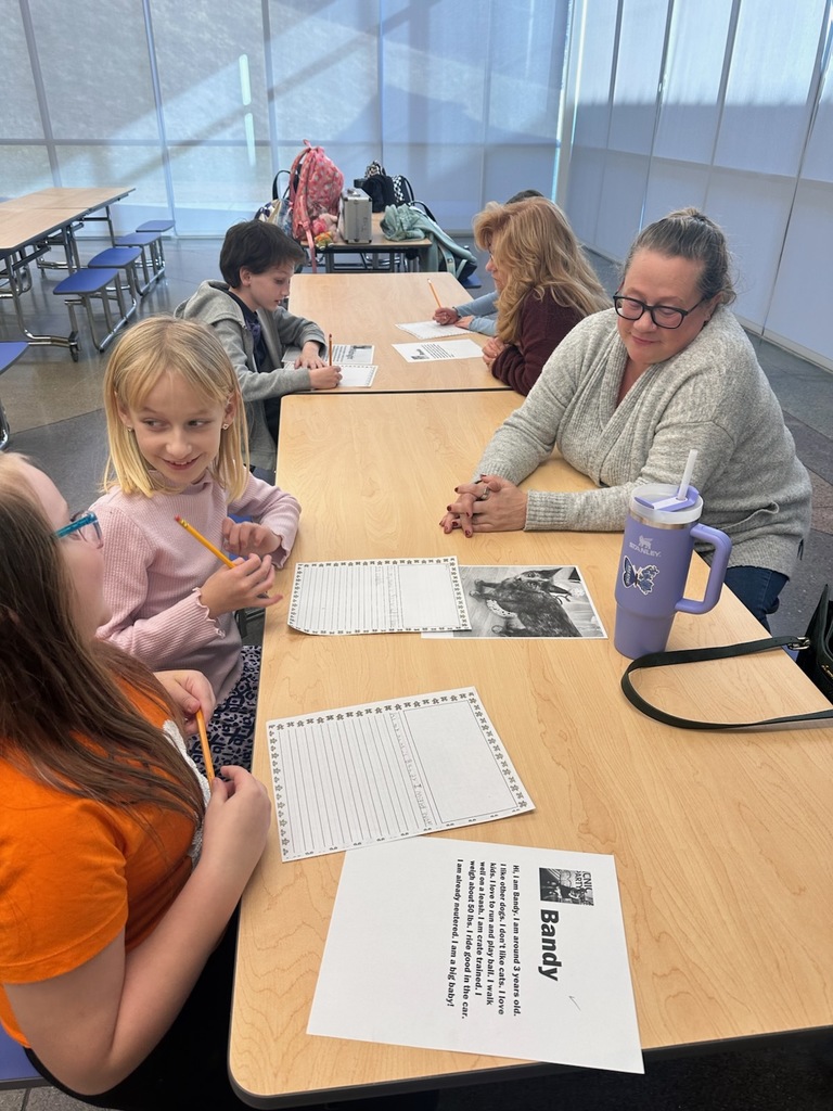 Students writing about their assigned animal from the shelter.