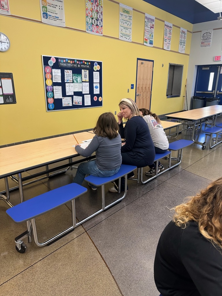 Students writing about their assigned animal from the shelter.