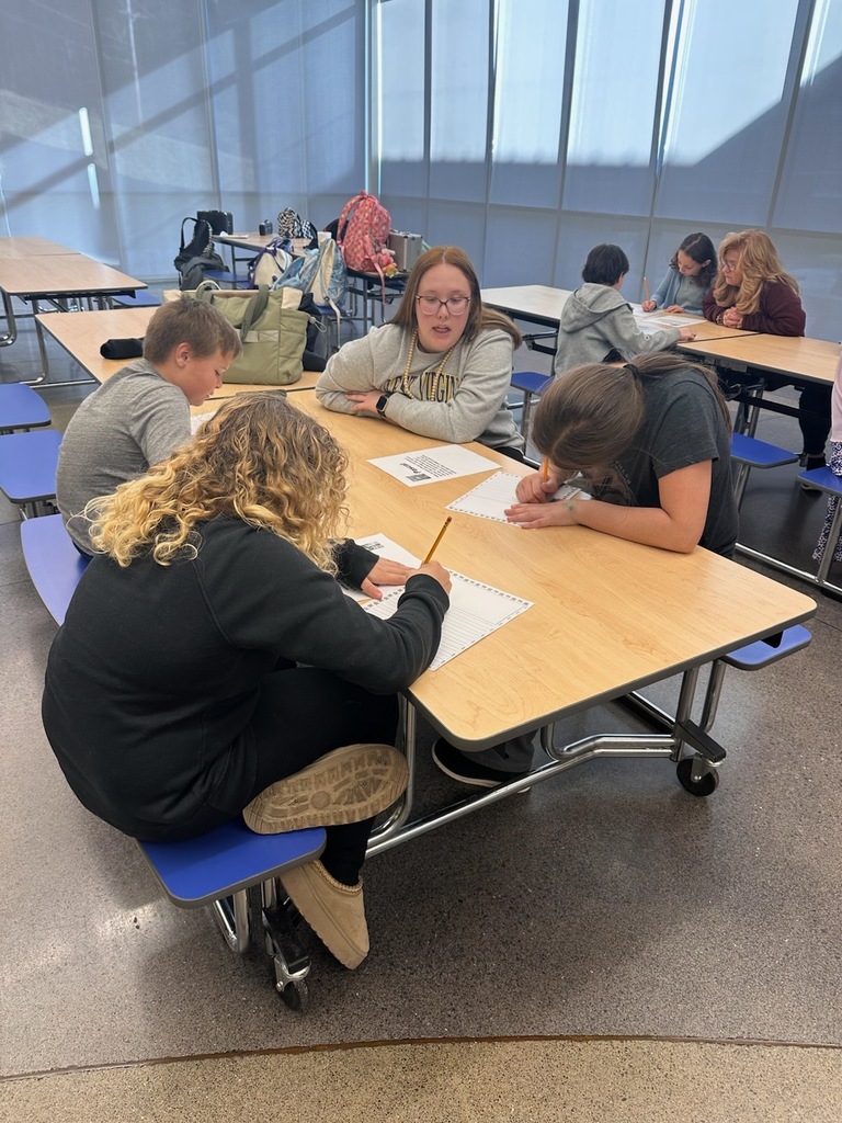 Students writing about their assigned animal from the shelter.