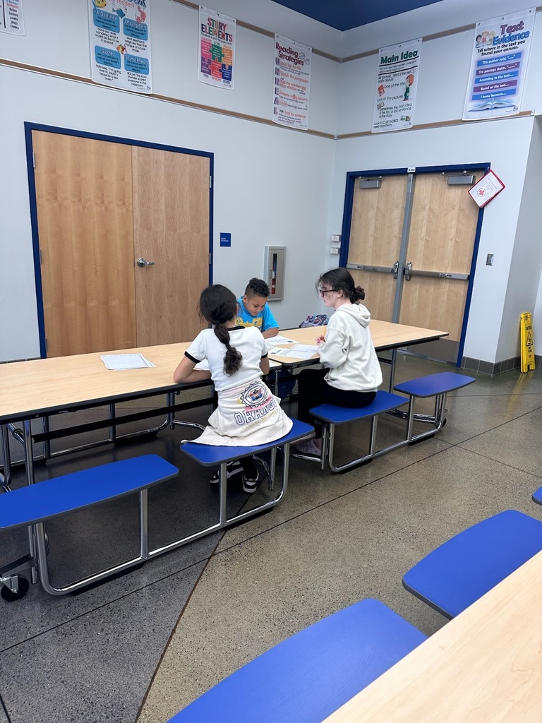 Students writing about their assigned animal from the shelter.