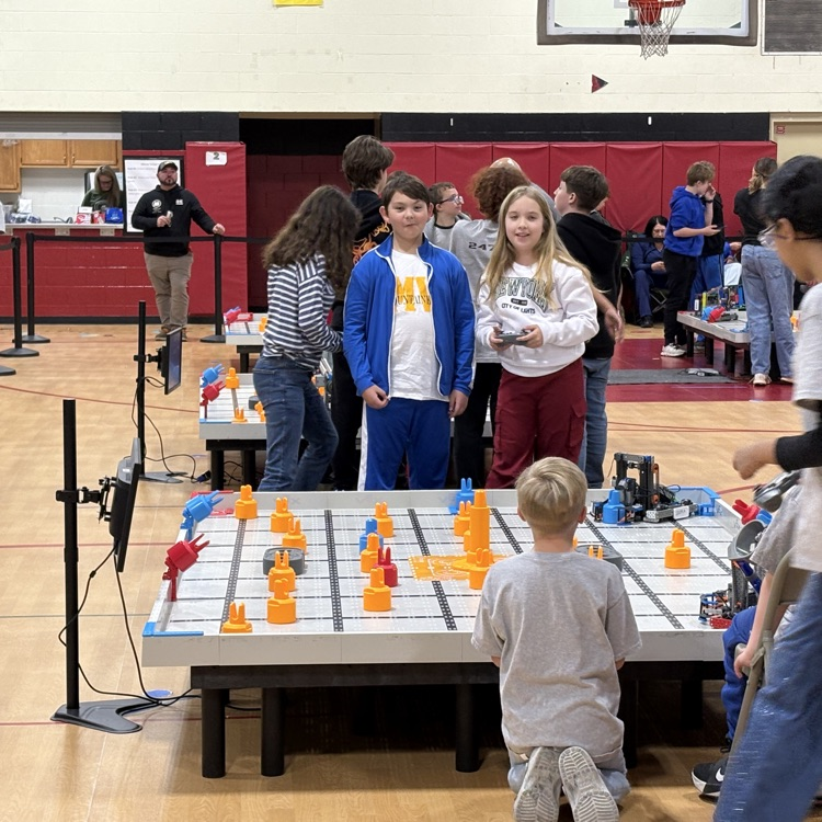 2 Mountain Valley students smiling for the camera before their robotics round starts  