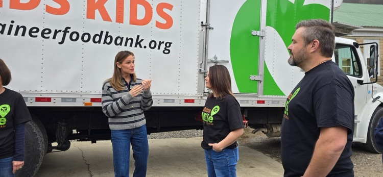 Actress Jennifer Garner helping Mountaineer Food Bank packing Thanksgiving boxes for families in need