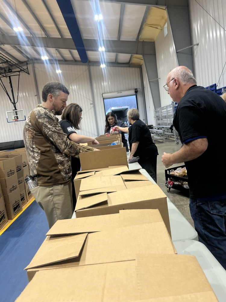 Actress Jennifer Garner helping Mountaineer Food Bank packing Thanksgiving boxes for families in need