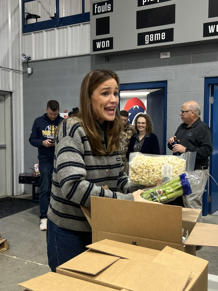 Actress Jennifer Garner helping Mountaineer Food Bank packing Thanksgiving boxes for families in need