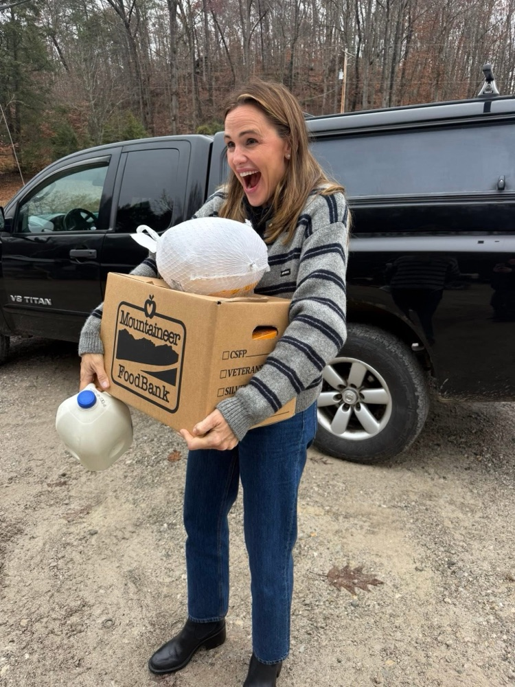 Actress Jennifer Garner helping Mountaineer Food Bank packing Thanksgiving boxes for families in need