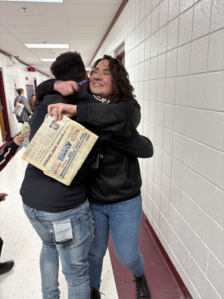 Jeremiah Jones hugging Mrs. Bulson