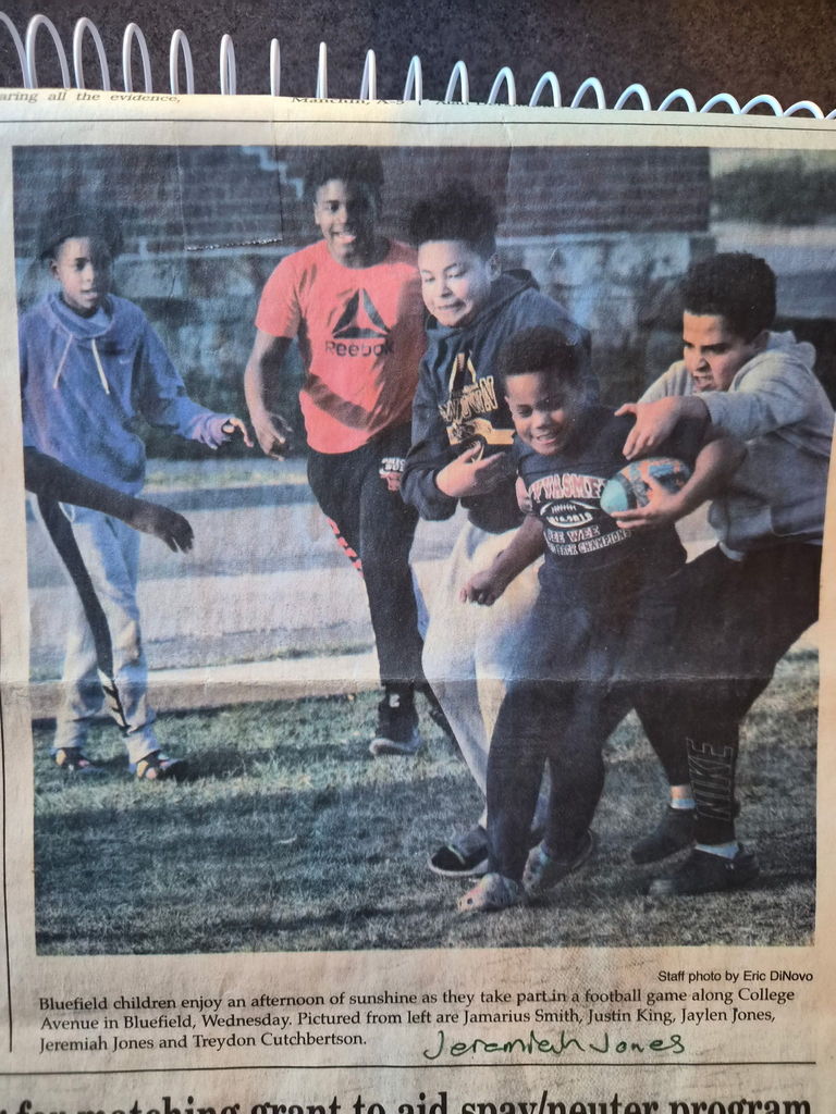 Jeremiah Jones as a 4th grader playing football in a church yard.