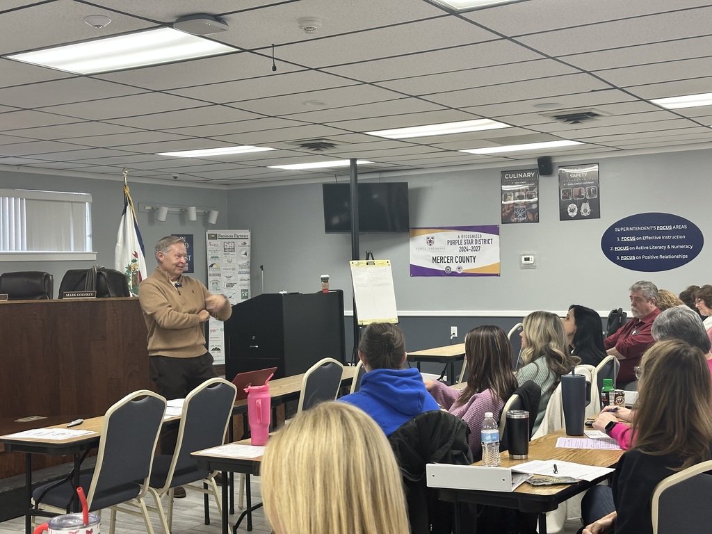Mr. McClanahan at the front of the room addressing Central Office Staff