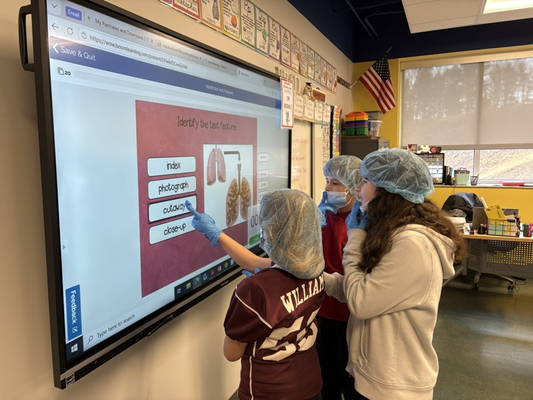 Fourth grade “scrubbed in” today to practice identifying and applying their knowledge of text features! 