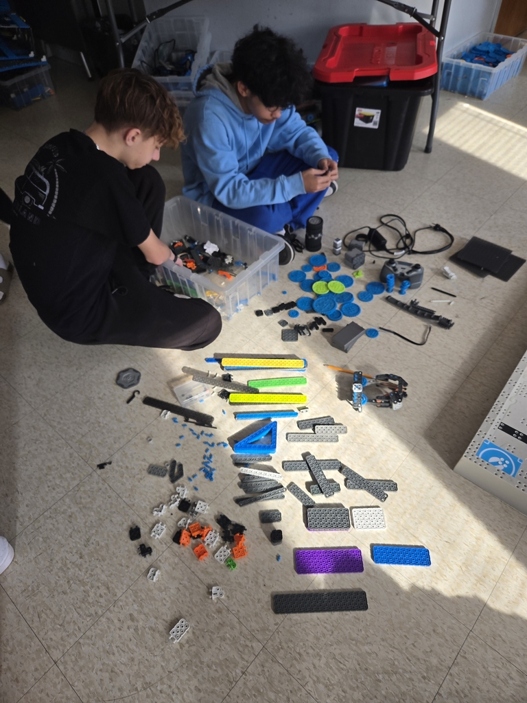 Students organizing robotics parts