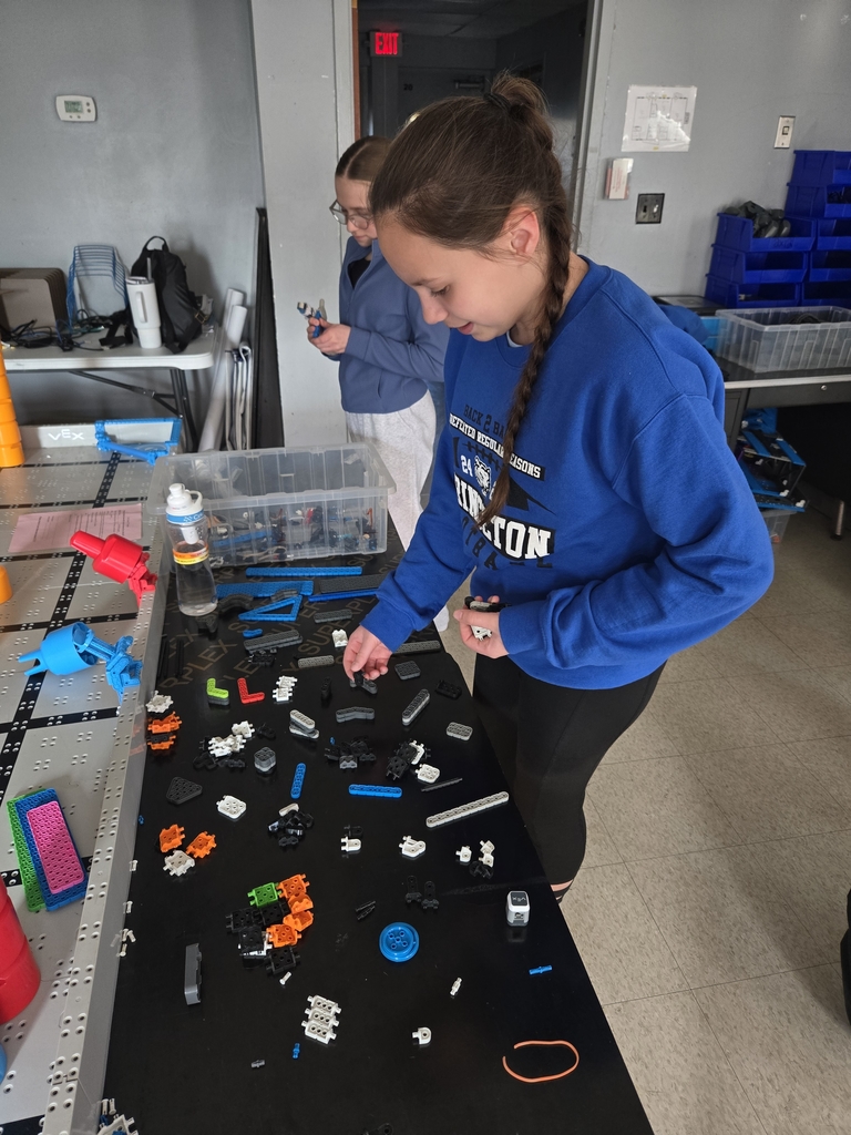 Students organizing robotics parts.