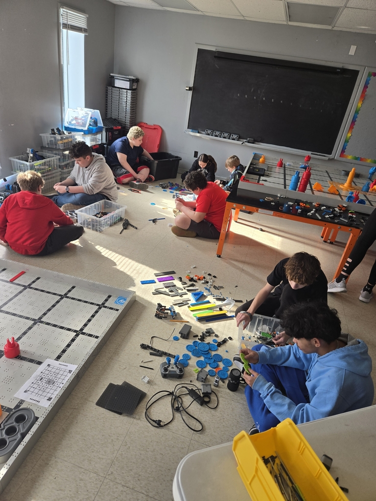 Students organizing robotics parts.