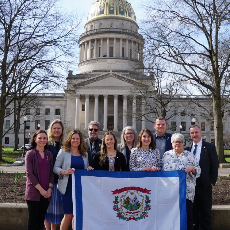 Kelli Stanley and Dr. Adkins attending a Milken Summit in Charleston  