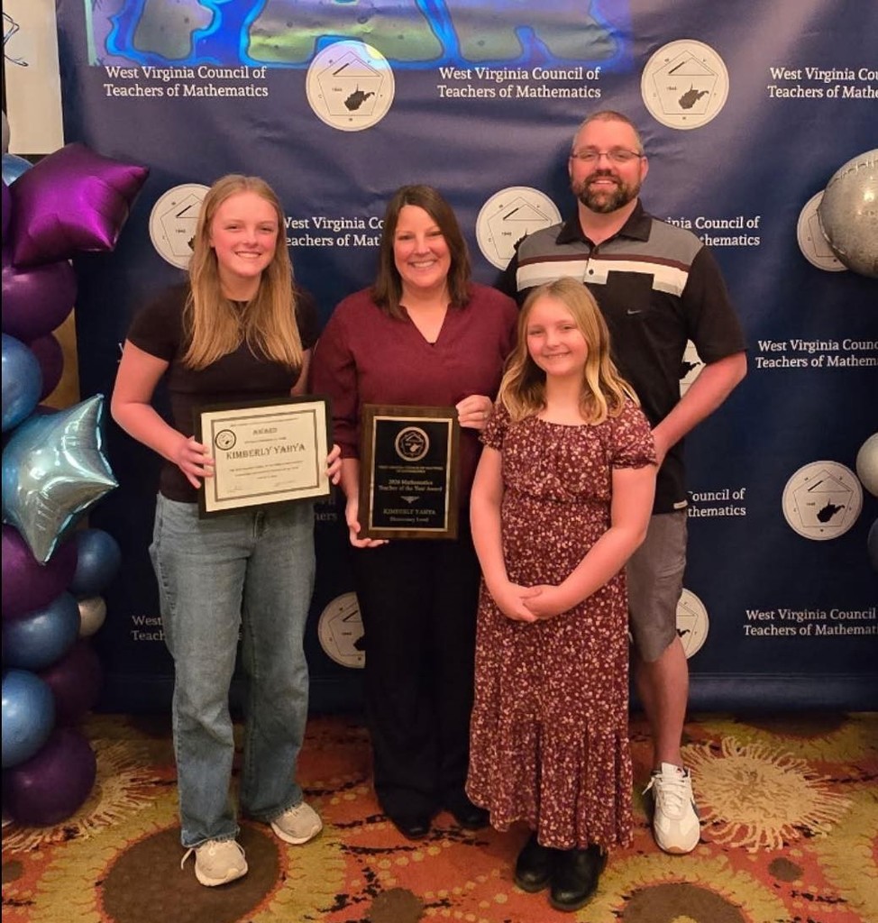 Mrs. Yahya and her family at the awards ceremony