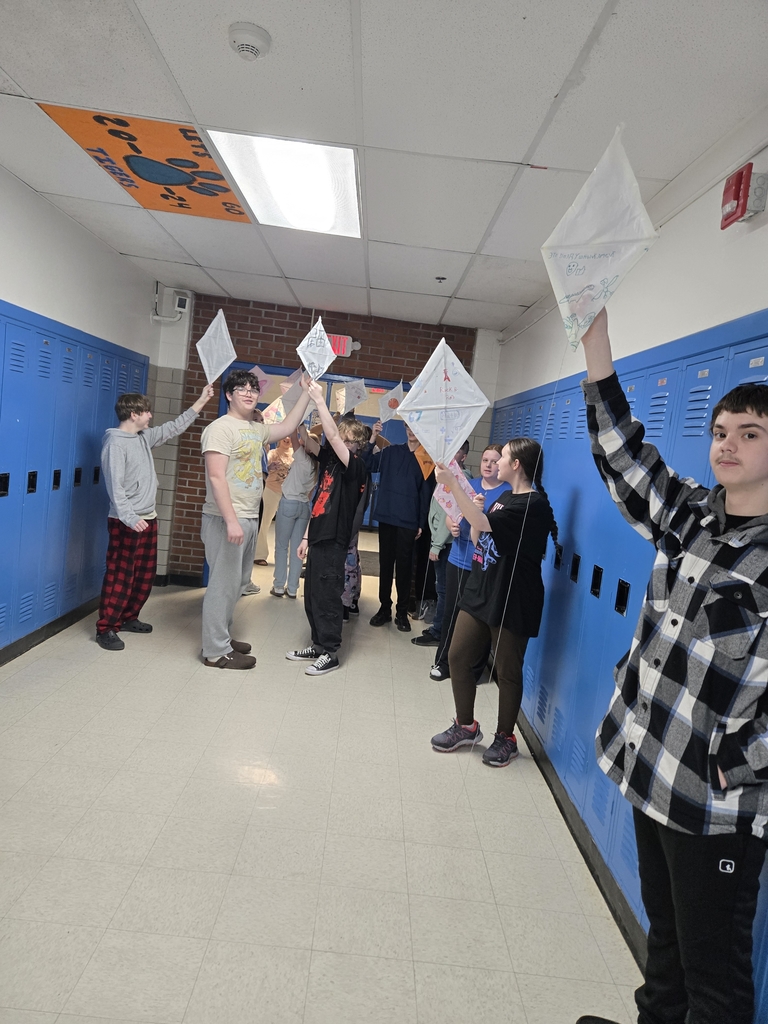 students holding up their kites 