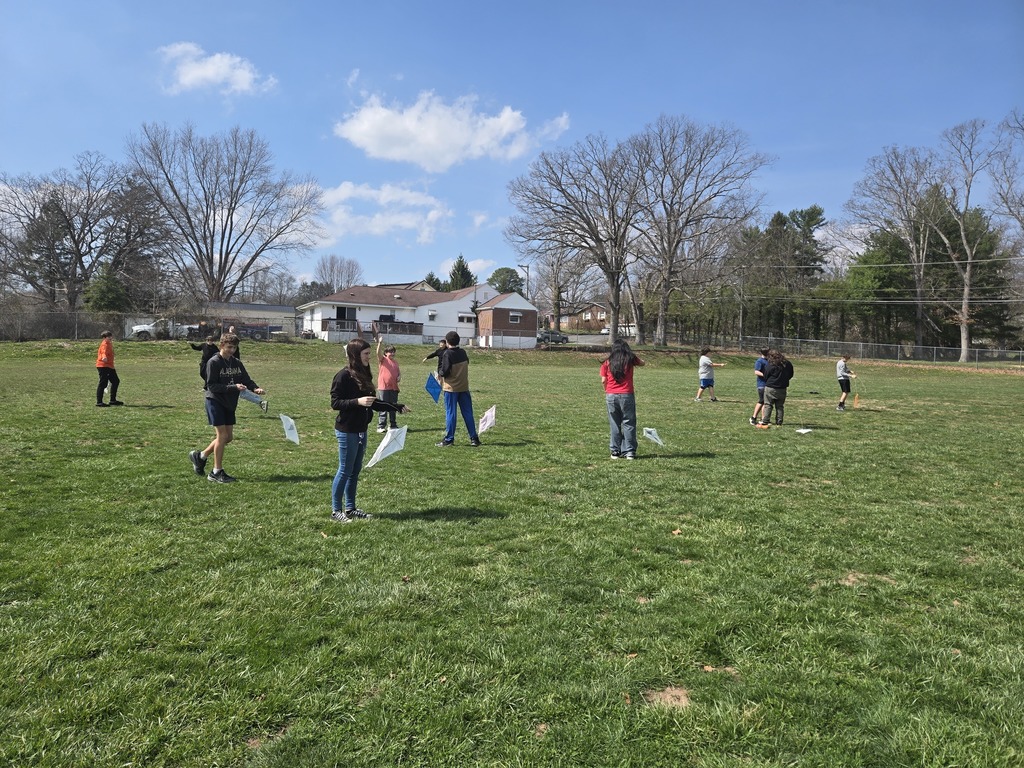 students standing in a field