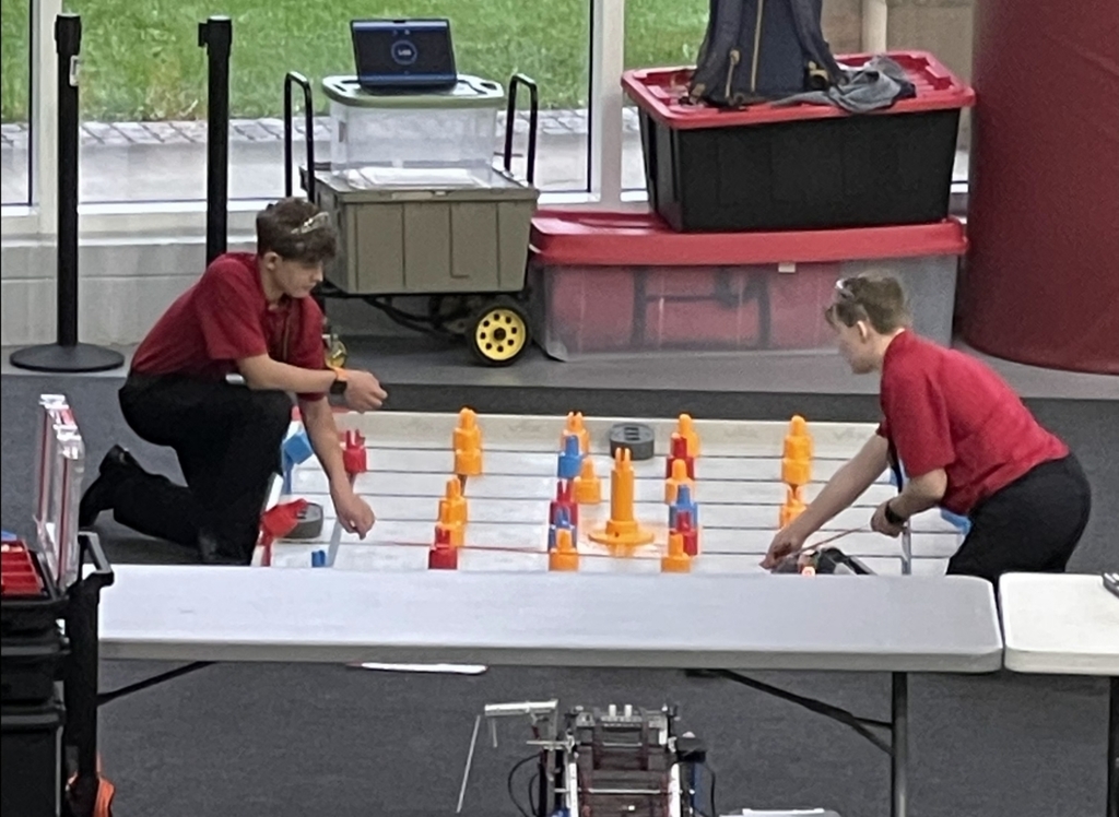 students and a robotics field