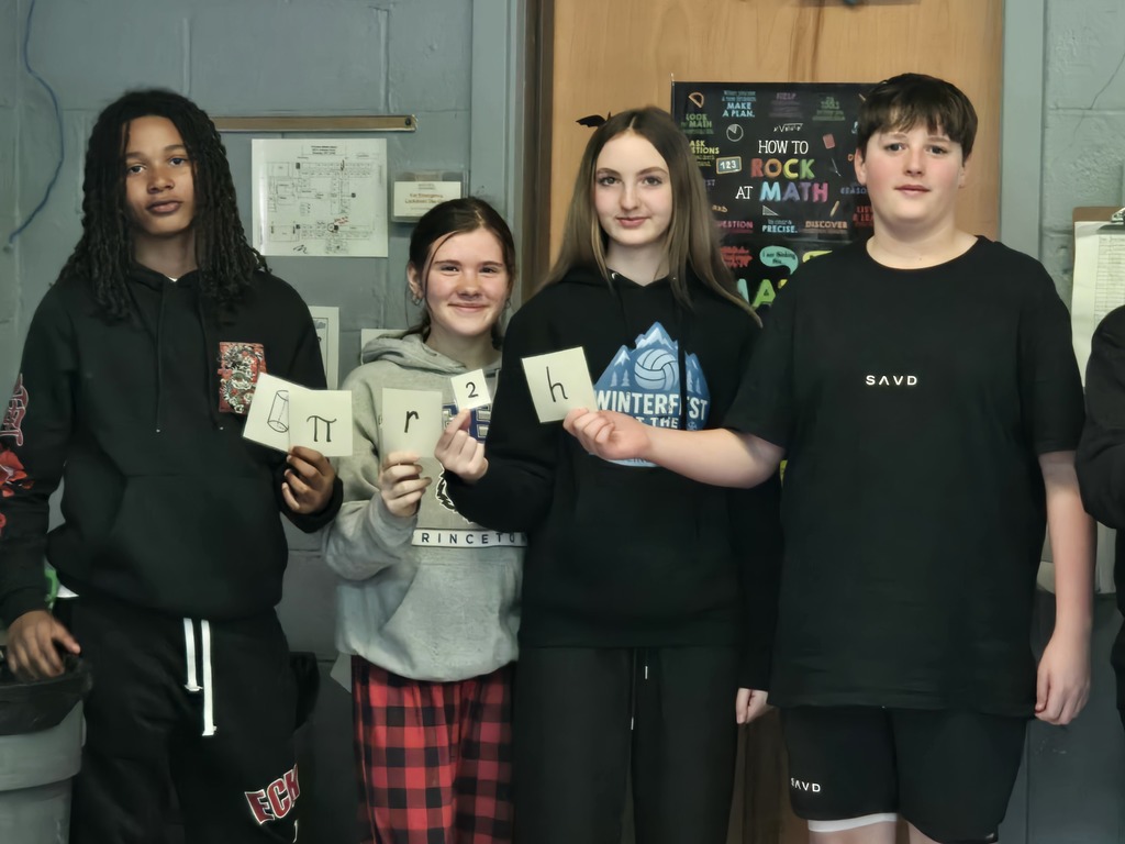 students holding a formula