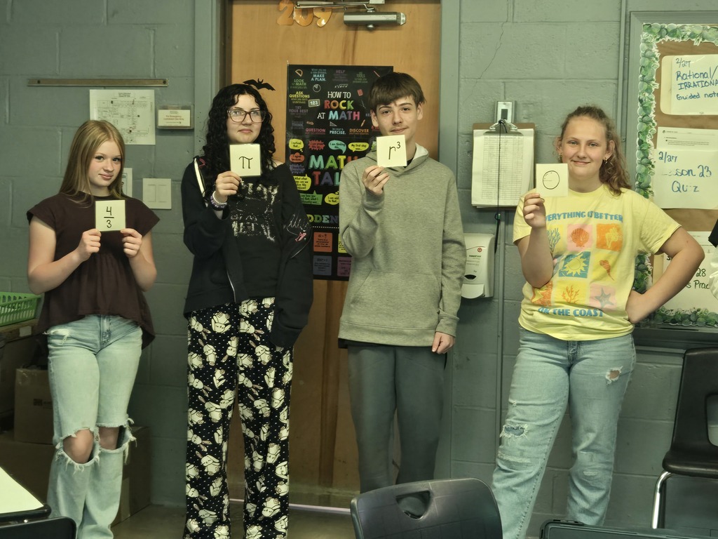 students holding a formula