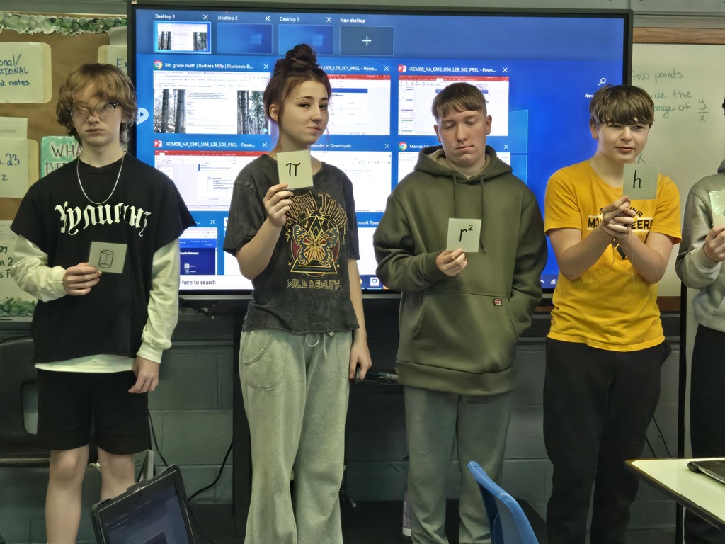 students holding a formula