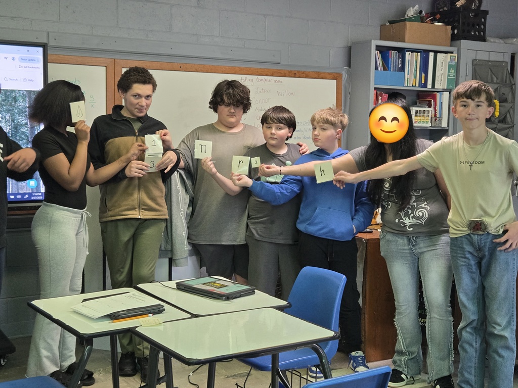students holding a formula