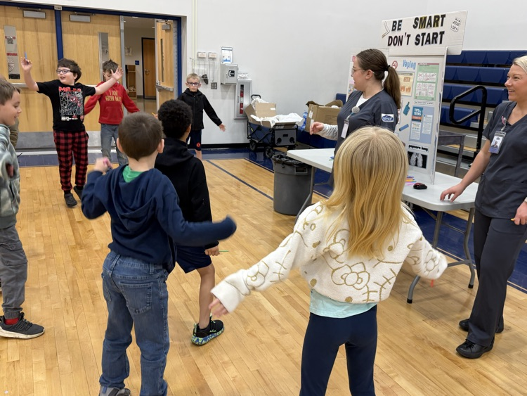 kids jumping up and down during presentation 