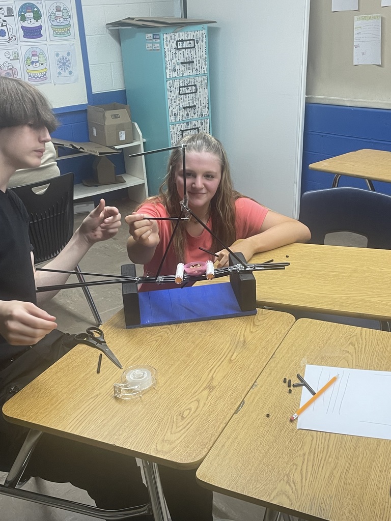 students trying out their bridges